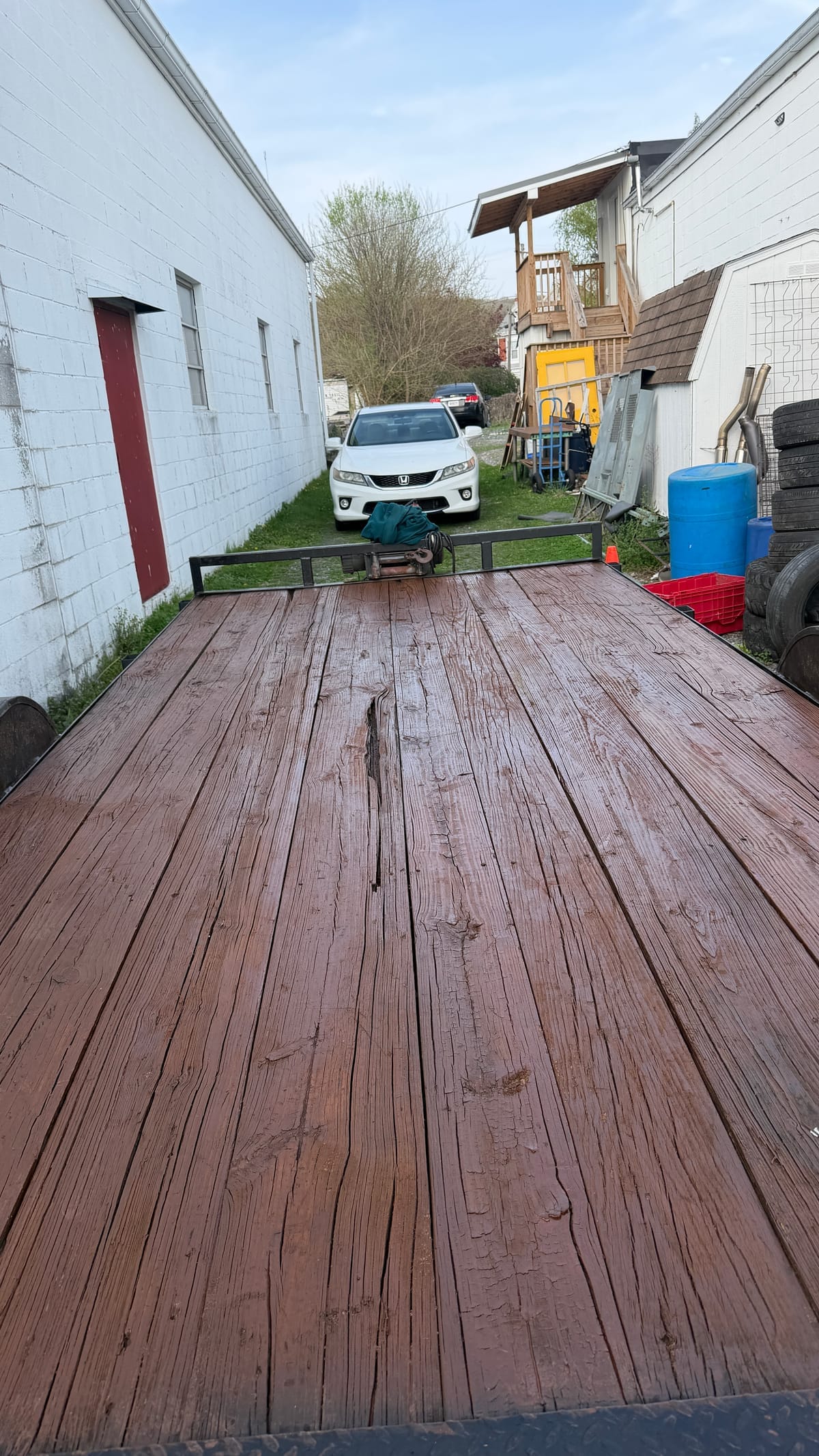 Freshly cleaned and stained dark brown trailer deck